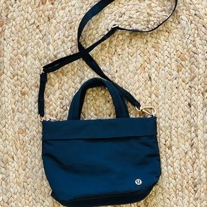 lululemon crossbody festival bag with gold accents